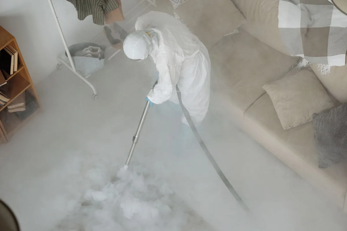 Biohazard cleanup technician in protective equipment, Ross, OH